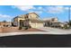 Charming two-story home with beautiful desert landscaping, three-car garage, and stone accents at 2684 Korea Ct, Henderson, NV 89052