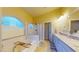 Bright primary bathroom featuring a soaking tub, separate shower, and dual vanity sinks at 2713 Tanagrine Dr, North Las Vegas, NV 89084