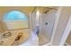Close up of the soaking tub and shower in the primary bathroom with great natural light at 2713 Tanagrine Dr, North Las Vegas, NV 89084
