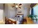 Bedroom features a wood bed frame, a ceiling fan, and a plant on the dresser near the window at 2713 Tanagrine Dr, North Las Vegas, NV 89084
