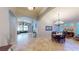 Elegant dining area with chandelier, table set for dining, and an open floorplan at 2713 Tanagrine Dr, North Las Vegas, NV 89084