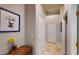 Hallway featuring a framed picture and decorative boot-shaped vase, and neutral walls at 2713 Tanagrine Dr, North Las Vegas, NV 89084