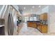 Spacious kitchen showcases granite countertops, stainless steel appliances, and a view to dining area at 2713 Tanagrine Dr, North Las Vegas, NV 89084