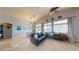 Open living room with vaulted ceilings, comfortable seating, and natural light from many windows at 2713 Tanagrine Dr, North Las Vegas, NV 89084