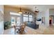 Inviting living room with large windows and a view to the patio area at 2713 Tanagrine Dr, North Las Vegas, NV 89084