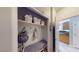 Functional mud room with storage baskets, hooks, and a bench at 2713 Tanagrine Dr, North Las Vegas, NV 89084