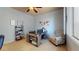 Inviting home office with desk, chair, shelving, and artwork creating an ideal workspace at 2713 Tanagrine Dr, North Las Vegas, NV 89084