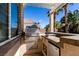 Outdoor kitchen featuring stainless steel grill, countertop space, and a mini fridge, perfect for al fresco dining and entertaining at 2713 Tanagrine Dr, North Las Vegas, NV 89084