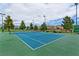 Well maintained tennis court with a blue surface, ready for a match in this active community at 2713 Tanagrine Dr, North Las Vegas, NV 89084