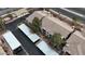 A complex featuring well-maintained roofs, carports, landscaping, and mature trees at 2900 Sunridge Heights Pkwy # 1916, Henderson, NV 89052