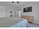 Modern bedroom featuring a sleek dresser, mounted TV, and soothing neutral color palette at 2900 Sunridge Heights Pkwy # 1916, Henderson, NV 89052