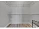 Spacious walk-in closet with built-in wire shelving and wood-look flooring at 2900 Sunridge Heights Pkwy # 1916, Henderson, NV 89052