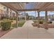 View of the community swimming pool and clubhouse seating area through a covered walkway at 2900 Sunridge Heights Pkwy # 1916, Henderson, NV 89052