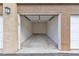 Empty one-car garage featuring concrete floors and an automatic door at 2900 Sunridge Heights Pkwy # 1916, Henderson, NV 89052