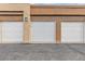 Three individual garages, each marked with unit numbers, showcasing secure parking at 2900 Sunridge Heights Pkwy # 1916, Henderson, NV 89052