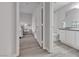 Hallway view with access to a bedroom and bathroom with white cabinets and granite countertops at 2900 Sunridge Heights Pkwy # 1916, Henderson, NV 89052