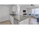 Open kitchen with granite countertops and stainless steel appliances, flowing into the living area at 2900 Sunridge Heights Pkwy # 1916, Henderson, NV 89052