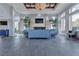 Comfortable lounge area with blue sofas, a fireplace, a large TV, and big windows at 2900 Sunridge Heights Pkwy # 1916, Henderson, NV 89052