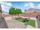 Outdoor patio area with an outdoor seating arrangement and low-maintenance desert rock landscaping at 3102 Honeysuckle Ave, North Las Vegas, NV 89031