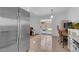 Bright space featuring a kitchen, workstation, and living area with outdoor access to the backyard at 3102 Honeysuckle Ave, North Las Vegas, NV 89031