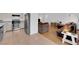 Open-concept floor plan connecting kitchen and living room with stainless steel appliances at 3102 Honeysuckle Ave, North Las Vegas, NV 89031