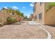 A large backyard with a concrete patio and desert landscaping, ready to create your dream outdoor space at 3273 Alcudia Bay Ave, Las Vegas, NV 89141