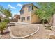 A neatly landscaped backyard with desert features, a concrete patio, and easy-to-maintain gravel accents at 3273 Alcudia Bay Ave, Las Vegas, NV 89141