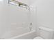 Bathroom features a tiled shower-tub combo and white fixtures at 3273 Alcudia Bay Ave, Las Vegas, NV 89141