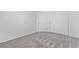Carpeted bedroom features closet and neutral paint at 3273 Alcudia Bay Ave, Las Vegas, NV 89141