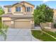 Inviting home featuring a three-car garage and well-maintained lawn, creating great curb appeal at 3273 Alcudia Bay Ave, Las Vegas, NV 89141