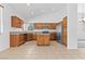 Bright kitchen featuring an island with seating, stainless steel appliances, and modern finishes at 3273 Alcudia Bay Ave, Las Vegas, NV 89141