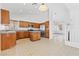 Efficient kitchen featuring ample counter space, stainless steel appliances, and convenient access to the living area at 3273 Alcudia Bay Ave, Las Vegas, NV 89141