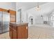 Open concept kitchen with a convenient island that flows into the adjacent living room at 3273 Alcudia Bay Ave, Las Vegas, NV 89141