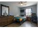 Bedroom with an eye-catching comforter, wood-look floors, and an inviting queen-size bed at 3728 Juanita May Ave, North Las Vegas, NV 89032