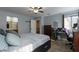 Bright bedroom with access to a well-lit bathroom, features wood-look floors and neutral-toned walls at 3728 Juanita May Ave, North Las Vegas, NV 89032