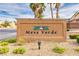 Mesa Verde community sign with desert landscaping, palm trees, and bright blue sky at 3728 Juanita May Ave, North Las Vegas, NV 89032