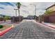 The community entrance features stone pillars and an automatic gate to enhance security at 3728 Juanita May Ave, North Las Vegas, NV 89032