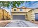 Charming two-story home with a two-car garage and a well-maintained front yard at 3728 Juanita May Ave, North Las Vegas, NV 89032