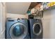 Convenient laundry room with Samsung washer and dryer and storage shelves at 3728 Juanita May Ave, North Las Vegas, NV 89032