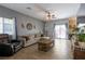 Spacious living room with wood-look floors, natural light, and a comfortable seating area at 3728 Juanita May Ave, North Las Vegas, NV 89032