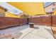 Cozy patio area with privacy fence and shaded awning, perfect for entertaining at 3728 Juanita May Ave, North Las Vegas, NV 89032