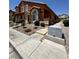 A two-story home with attractive landscaping, a covered entrance, and a well-maintained sidewalk at 3759 Sand Pier St, Las Vegas, NV 89147