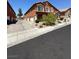 A two-story home featuring an inviting exterior with a private driveway and well-kept landscaping at 3759 Sand Pier St, Las Vegas, NV 89147