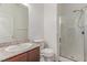 Bathroom featuring shower with glass door, sink, and toilet at 3821 E Summit Ave, Pahrump, NV 89061