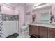 Bright bathroom featuring a walk-in tub, double sinks, and marble countertops at 3821 E Summit Ave, Pahrump, NV 89061