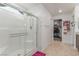 Bathroom featuring a glass enclosed shower, tile floor, and a glimpse of the walk-in closet at 3821 E Summit Ave, Pahrump, NV 89061