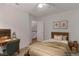 Comfortable bedroom featuring desk and warm lighting at 3821 E Summit Ave, Pahrump, NV 89061