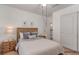 Cozy bedroom with a rustic wooden headboard and soft, inviting bedding at 3821 E Summit Ave, Pahrump, NV 89061
