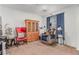 Neutral bedroom featuring a wood china cabinet, arm chair, and beige recliner chair at 3821 E Summit Ave, Pahrump, NV 89061