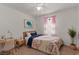 Bright bedroom with a floral comforter, desk, and soft natural light at 3821 E Summit Ave, Pahrump, NV 89061